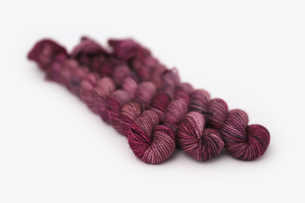 speckled hand dyed white pink dark mauve maroon merino sock mini yarn