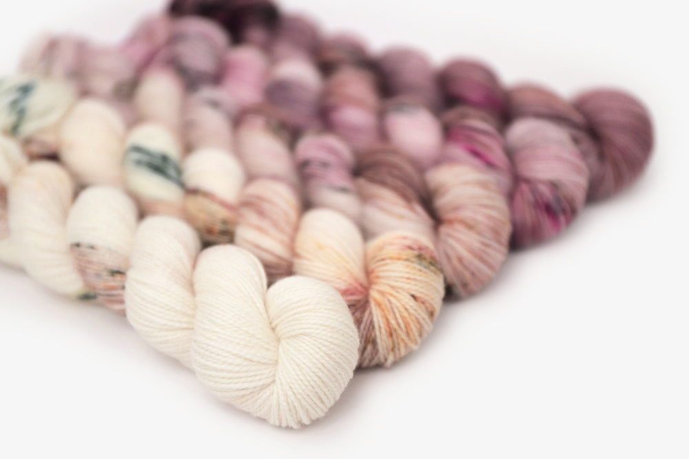 speckled hand dyed white pink mauve maroon yarn 50s set