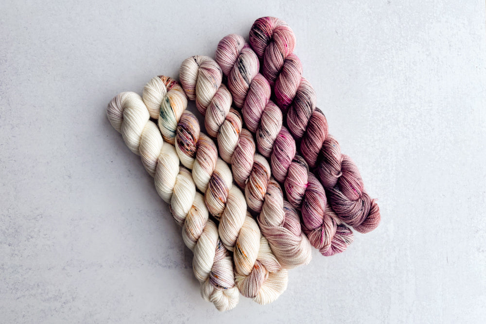 speckled hand dyed white pink mauve yarn 50s set