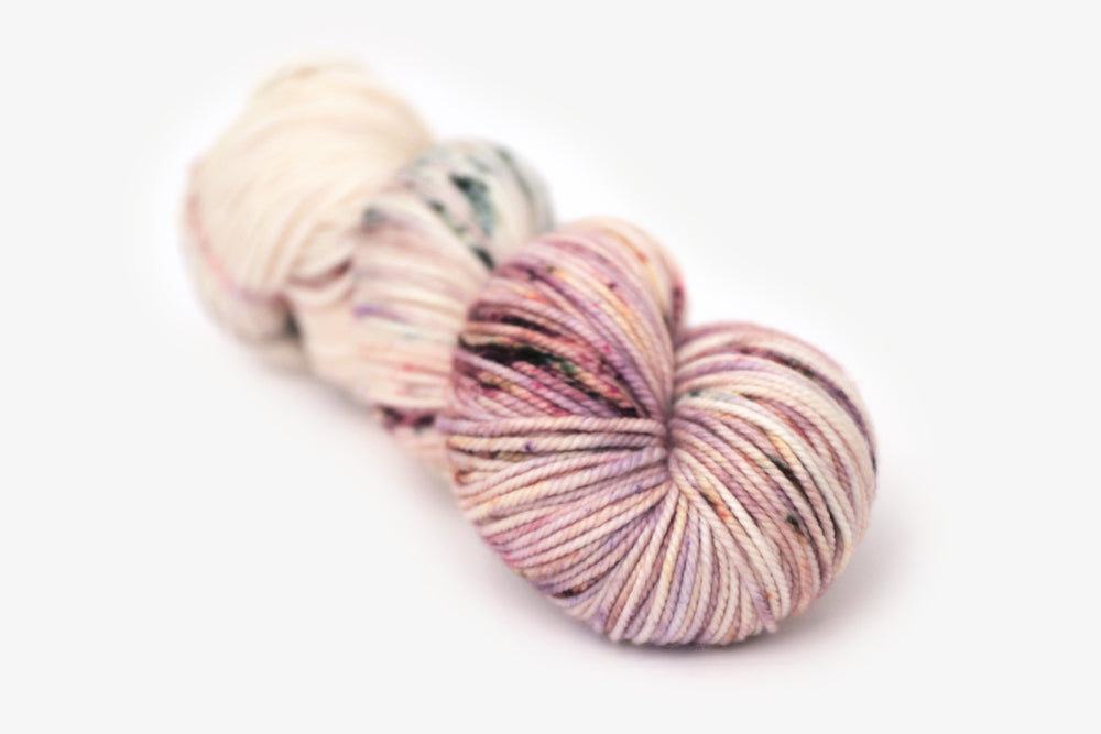speckled hand dyed white pink mauve bulky yarn
