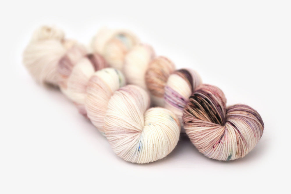 speckled hand dyed white pink mauve mini phyllis sock yarn