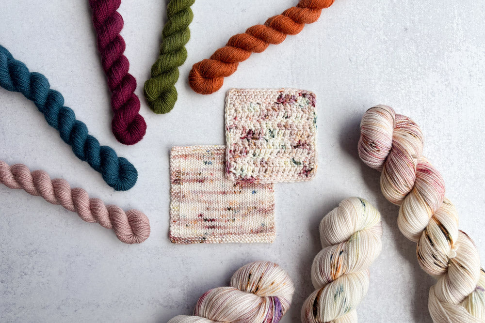 speckled hand dyed white pink mauve sock yarn swatches