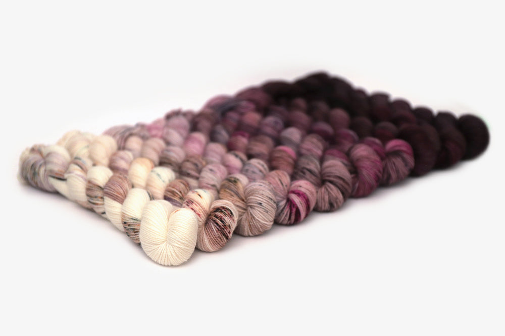 speckled hand dyed white pink dark mauve maroon brown yarn 50s set