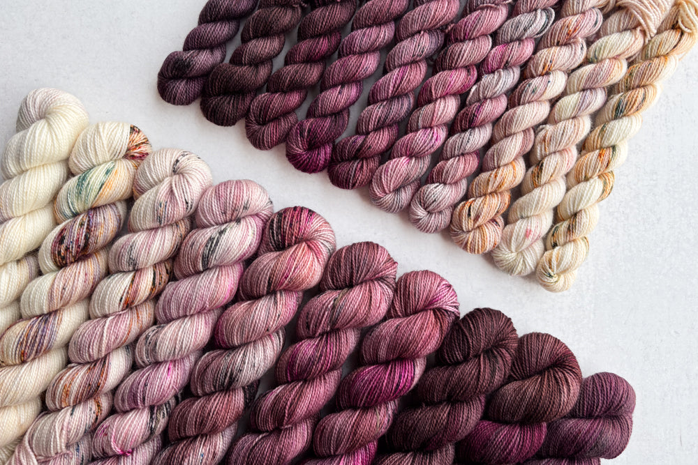speckled hand dyed white pink dark mauve maroon brown yarn sets