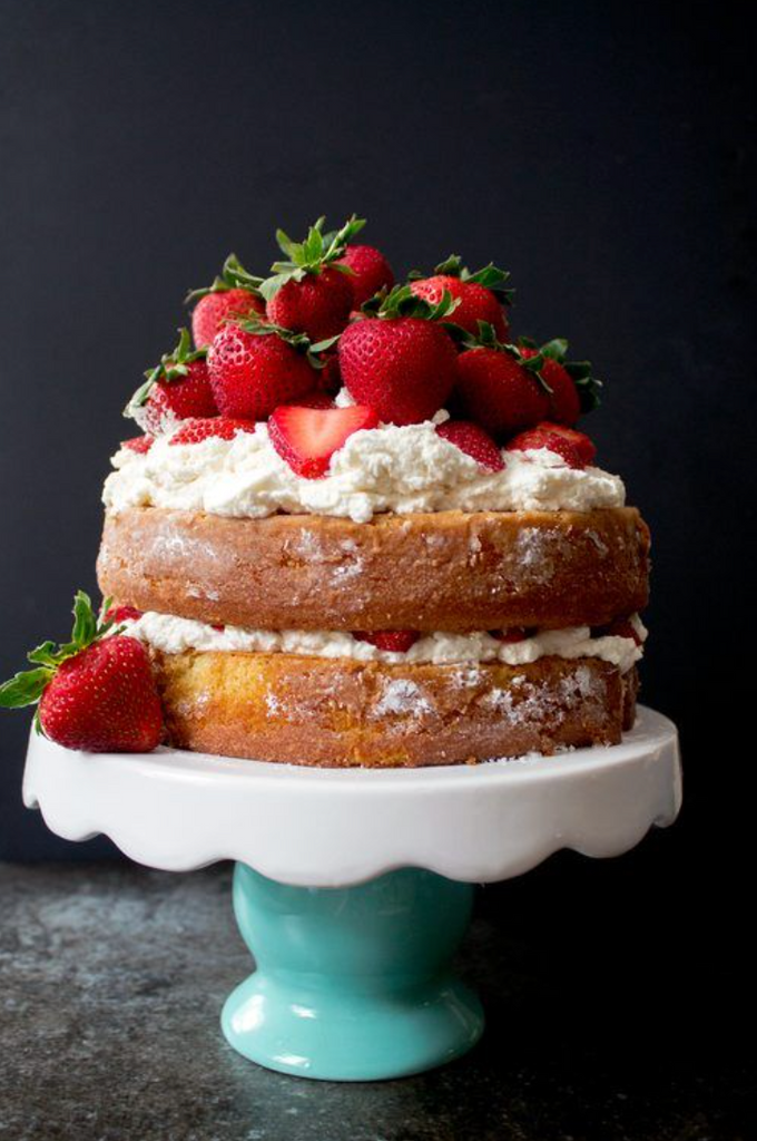 strawberry shortcake with whipped cream on ceramic