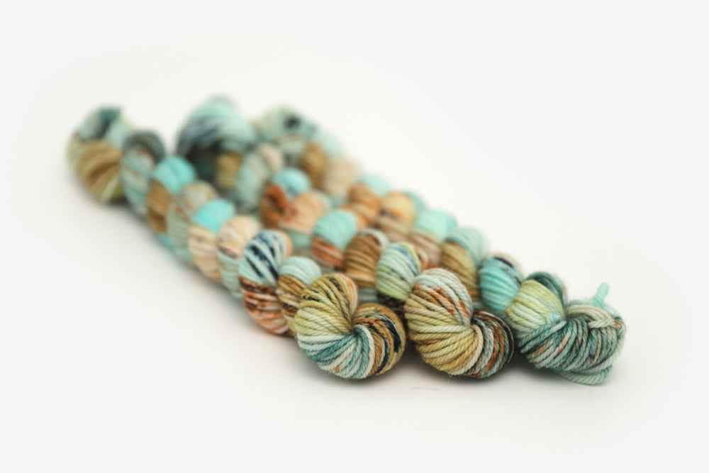 speckled hand dyed bright teal emerald tan orange dk mini yarn