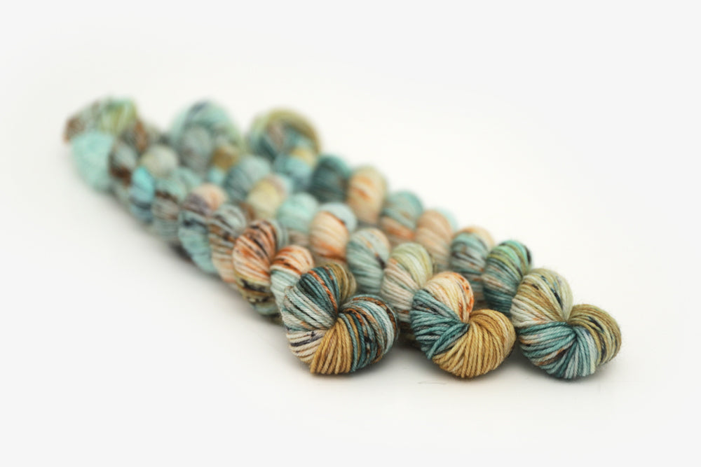 speckled hand dyed bright teal emerald tan orange phyllis sock mini yarn