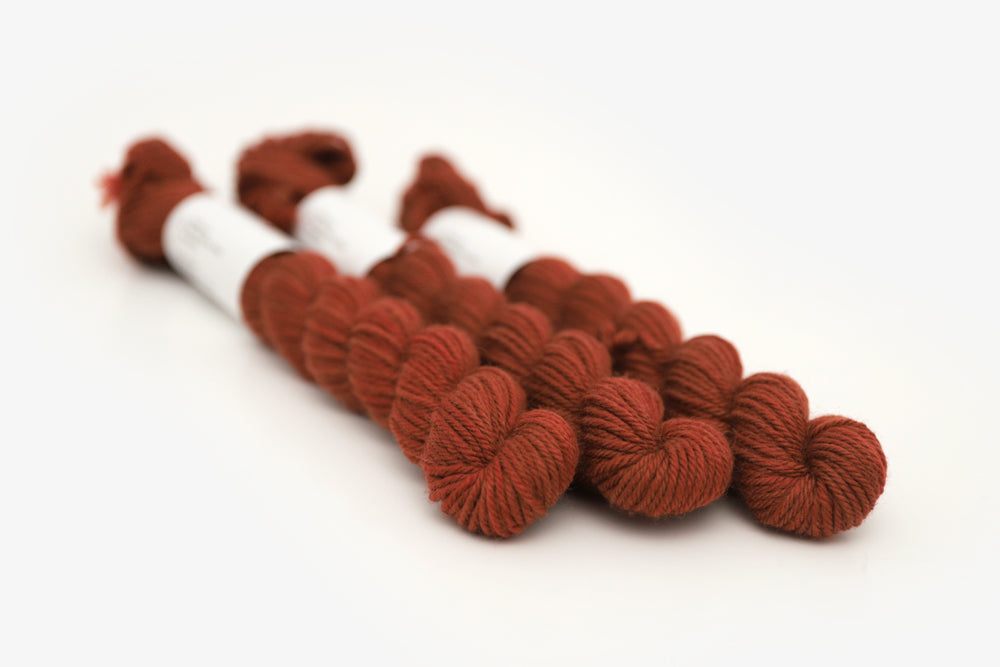 semisolid hand dyed dark rust red dk mini yarn