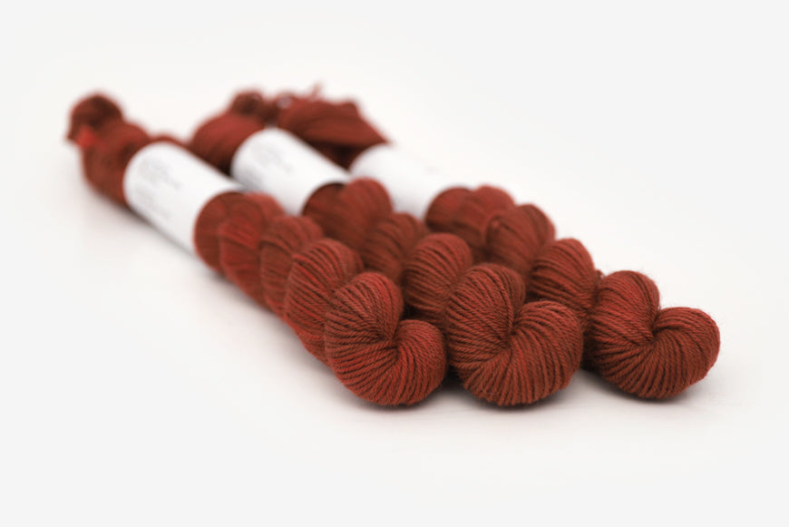 semisolid hand dyed dark rust red phyllis sock mini yarn