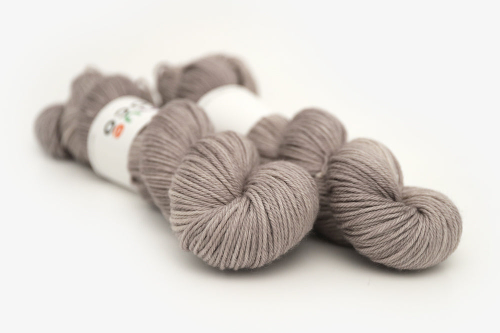 semisolid hand dyed warm greige gray worsted yarn
