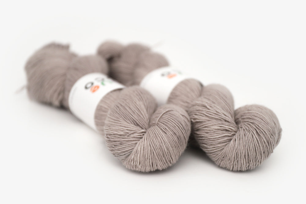 semisolid hand dyed warm greige gray single sock yarn