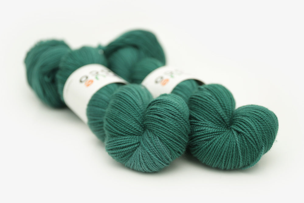 semisolid hand dyed emerald (dark blue green) merino sock yarn