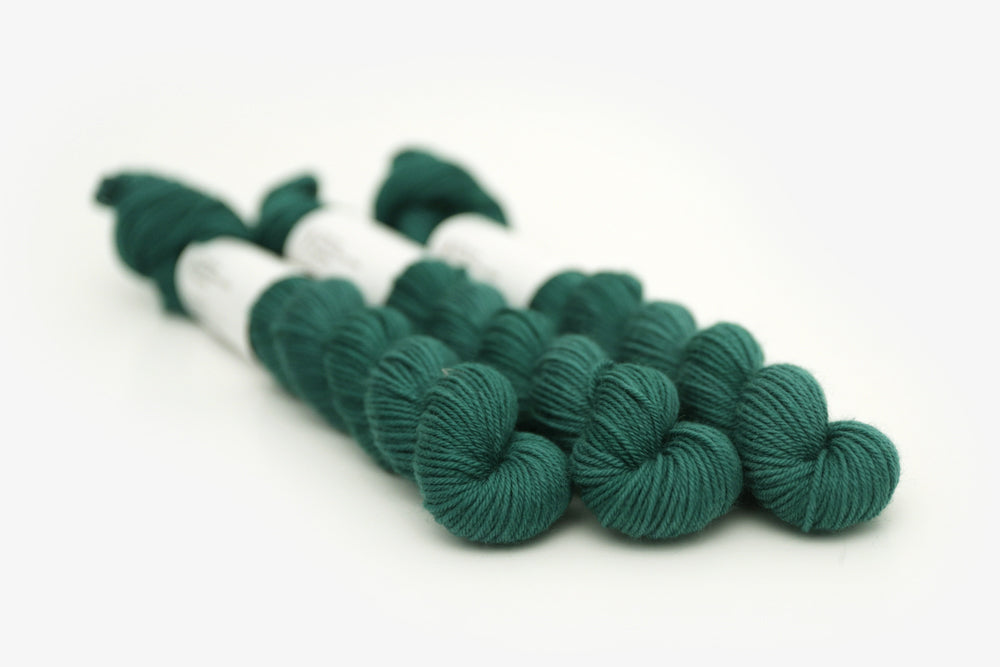 semisolid hand dyed emerald (dark blue green) phyllis sock yarn