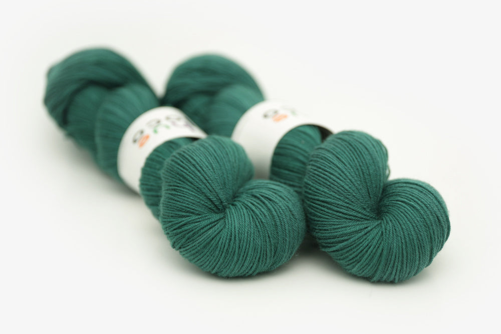 semisolid hand dyed emerald (dark blue green) phyllis sock yarn
