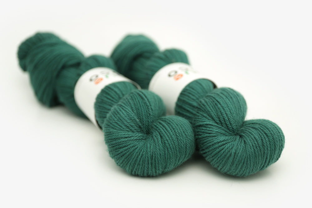 semisolid hand dyed emerald (dark blue green) worsted yarn