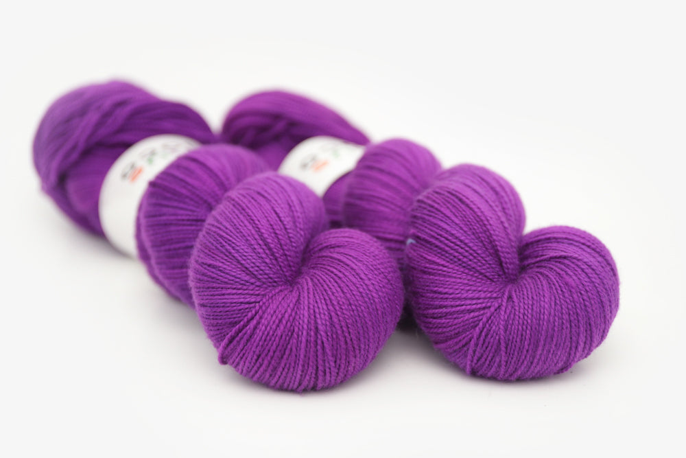 semisolid hand dyed bright pink purple spun xl yarn