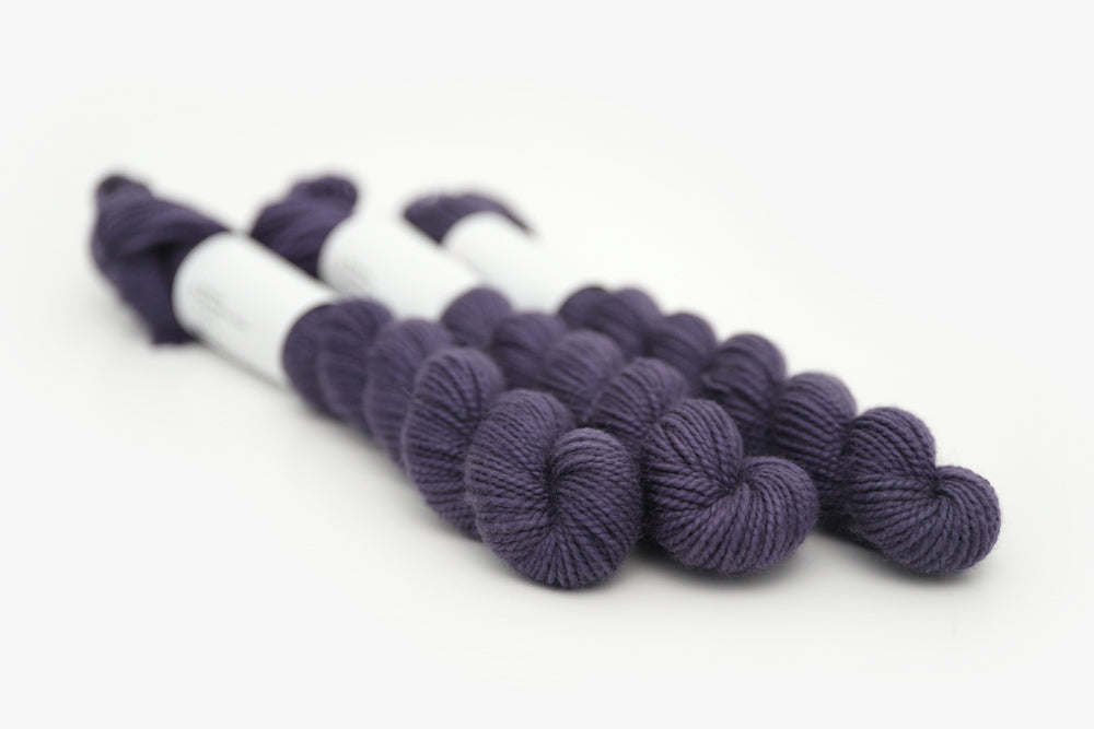 semisolid hand dyed juniper (dark navy purple blue) merino sock mini yarn