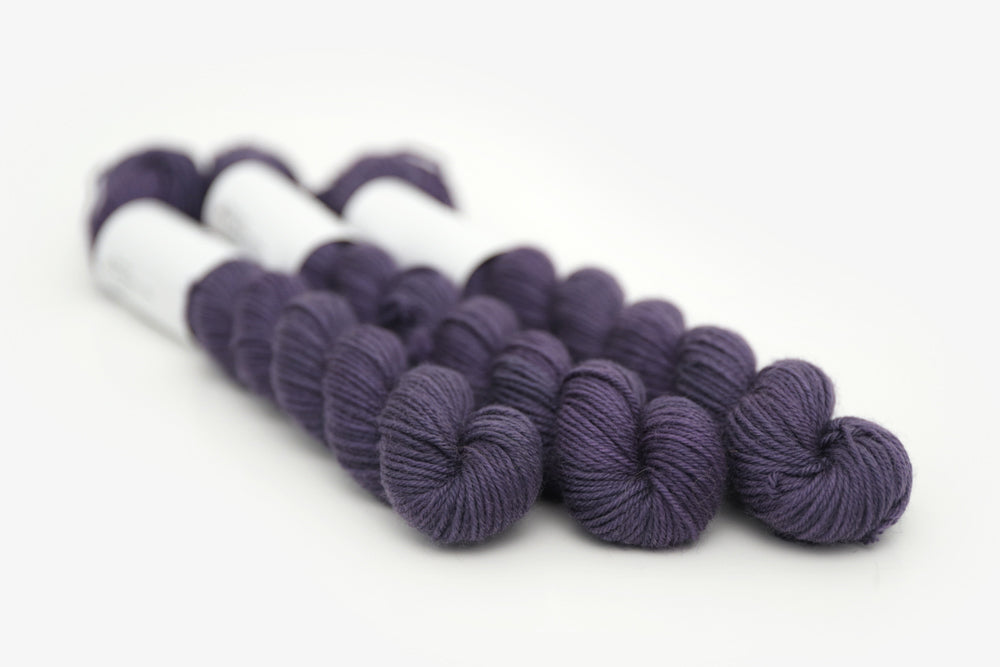 semisolid hand dyed juniper (dark navy purple blue) phyllis sock mini yarn