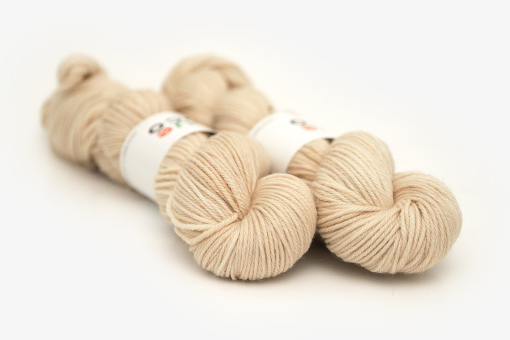 semisolid hand dyed light beige tan worsted yarn