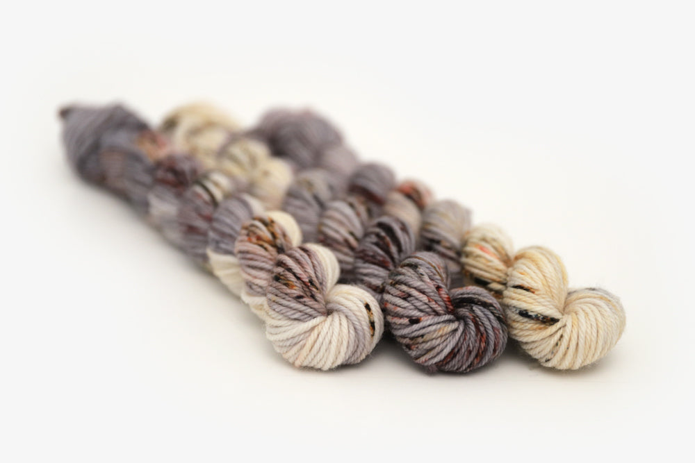 speckled hand dyed warm white gray brown maroon dk mini yarn