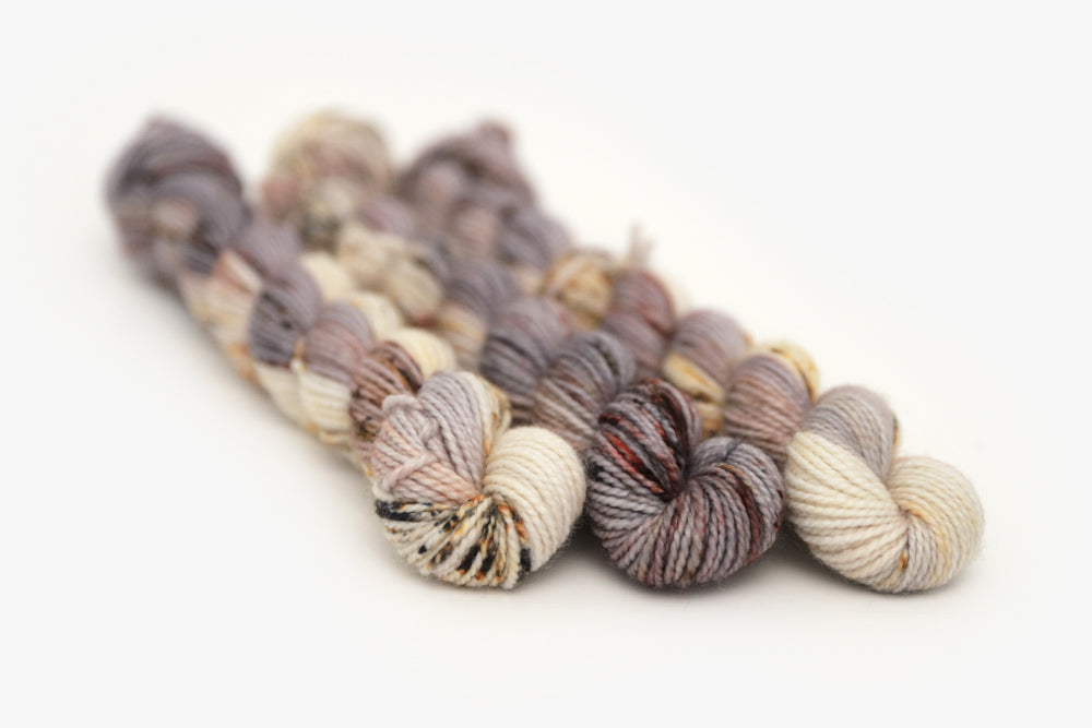 speckled hand dyed warm white gray brown maroon merino sock mini yarn