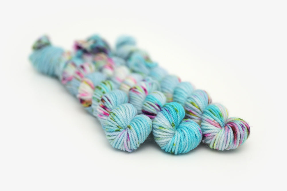 speckled hand dyed bright aqua green purple dk mini yarn
