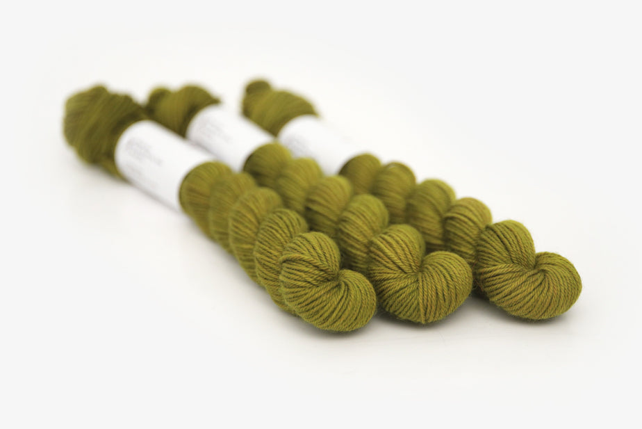 semisolid hand dyed pear (dark olive yellow green) phyllis sock mini yarn