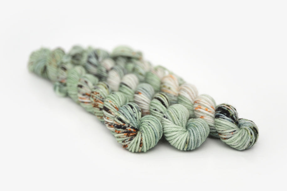 speckled hand dyed pale green sage peach dk mini yarn