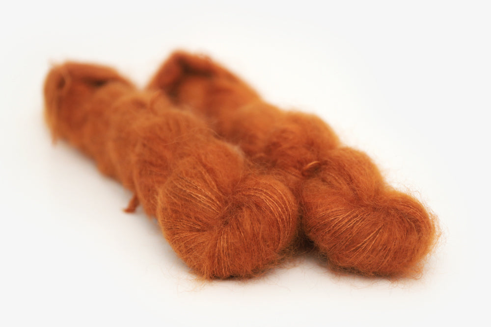 semisolid hand dyed pumpkin (dark burnt orange) mohair lace yarn