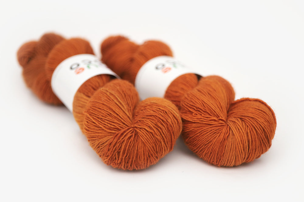 semisolid hand dyed pumpkin (dark burnt orange) single sock yarn