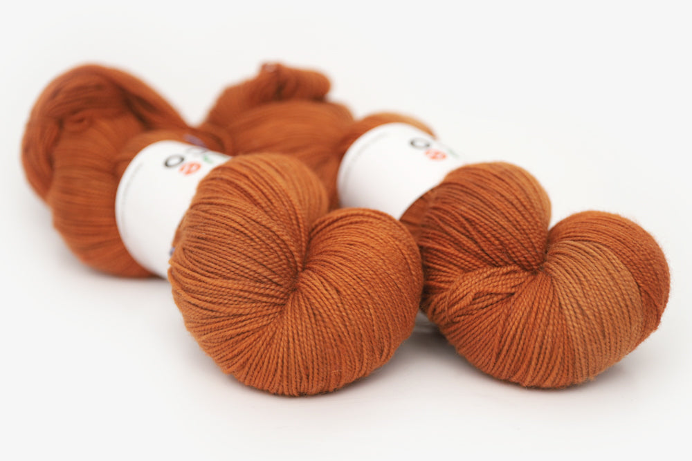 semisolid hand dyed pumpkin (dark burnt orange) spun xl yarn