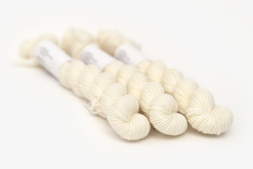 semisolid hand dyed ivory white merino sock mini yarn