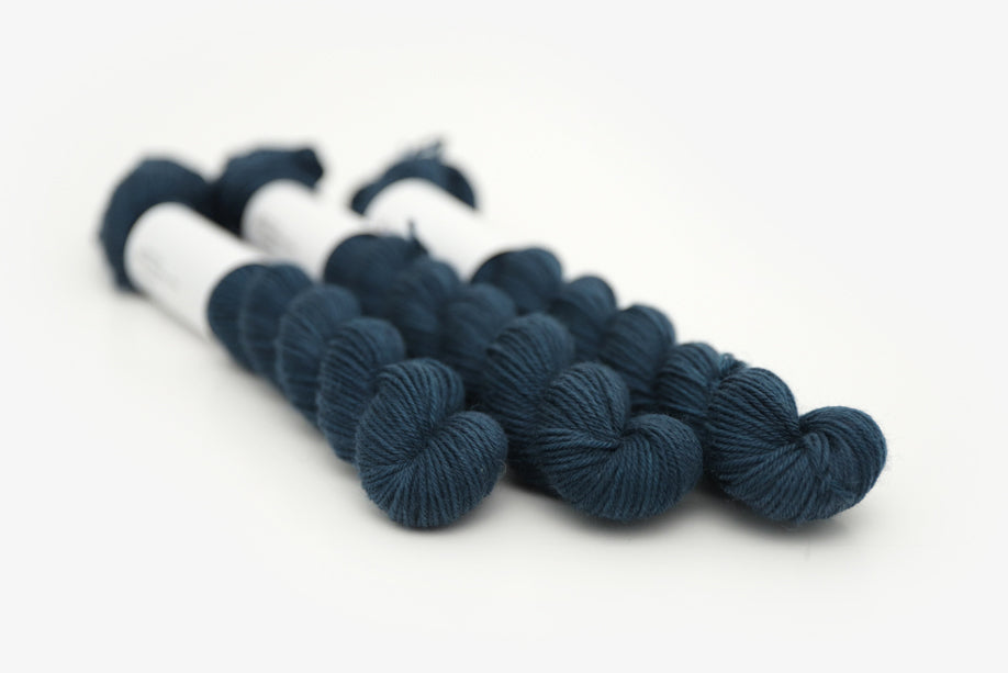 semisolid hand dyed spruce (dark teal green) phyllis sock mini yarn