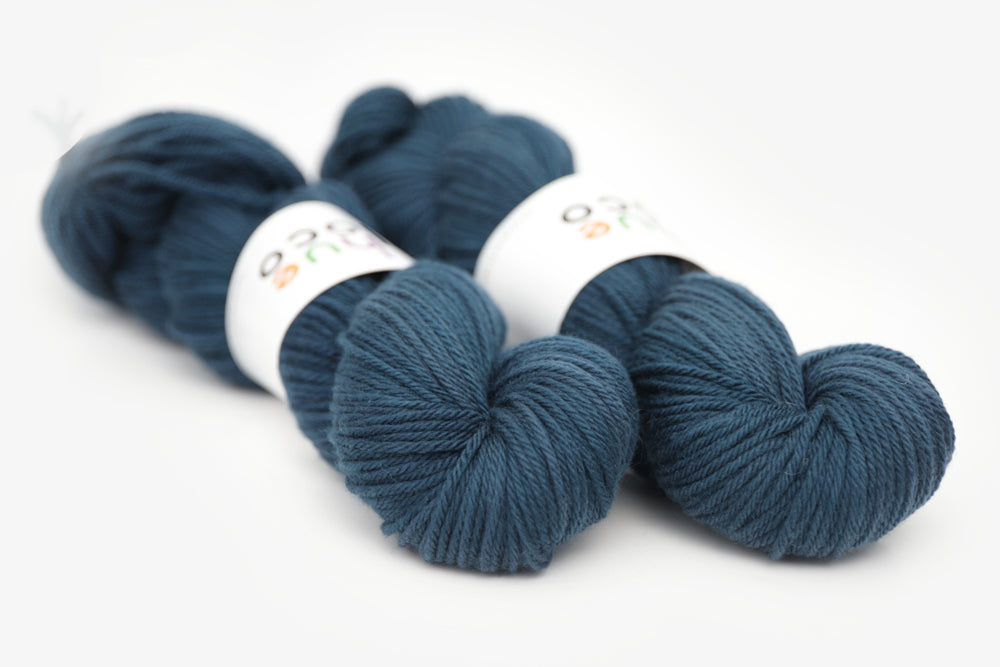 semisolid hand dyed spruce (dark teal green) worsted yarn